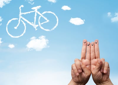 Happy cheerful smiley fingers looking at a bicycle shapeed cloud